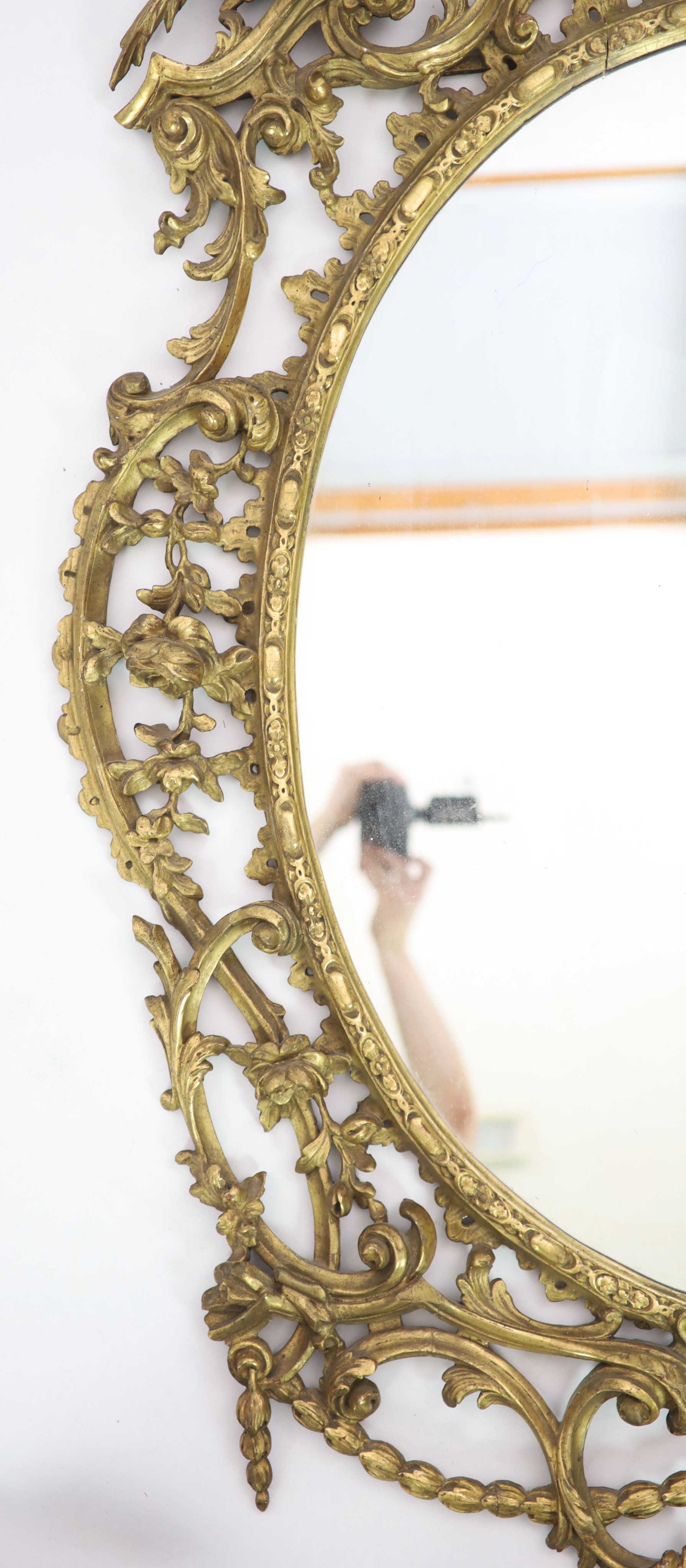 A 19th century Chippendale style gilt and gesso wall mirror W 104cm H 157cm